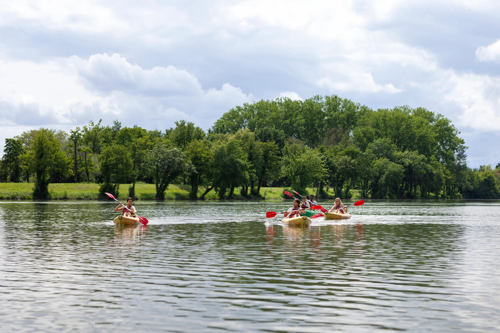 Family kayaking together outdoors