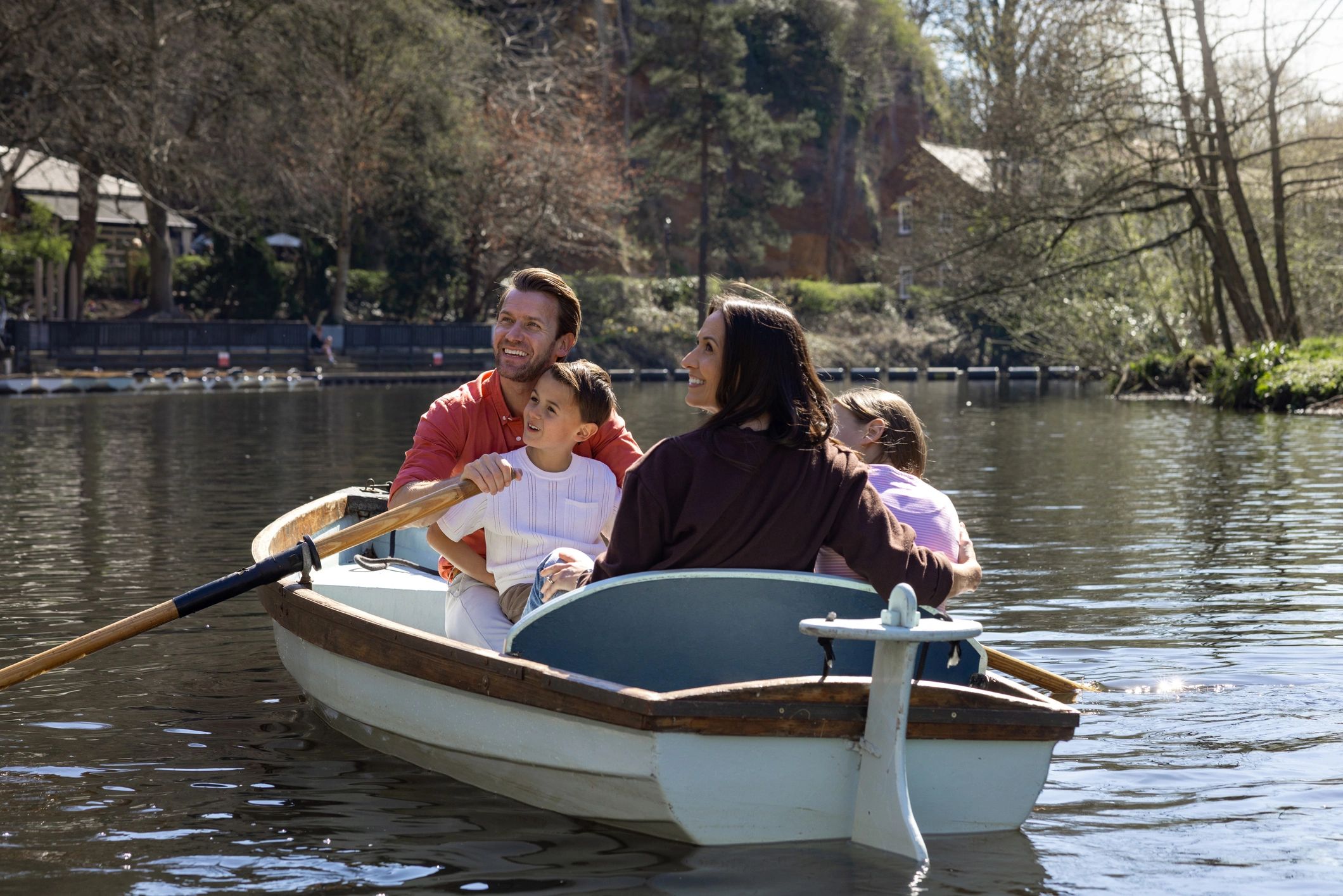Guests enjoying a scenic boat ride on the water