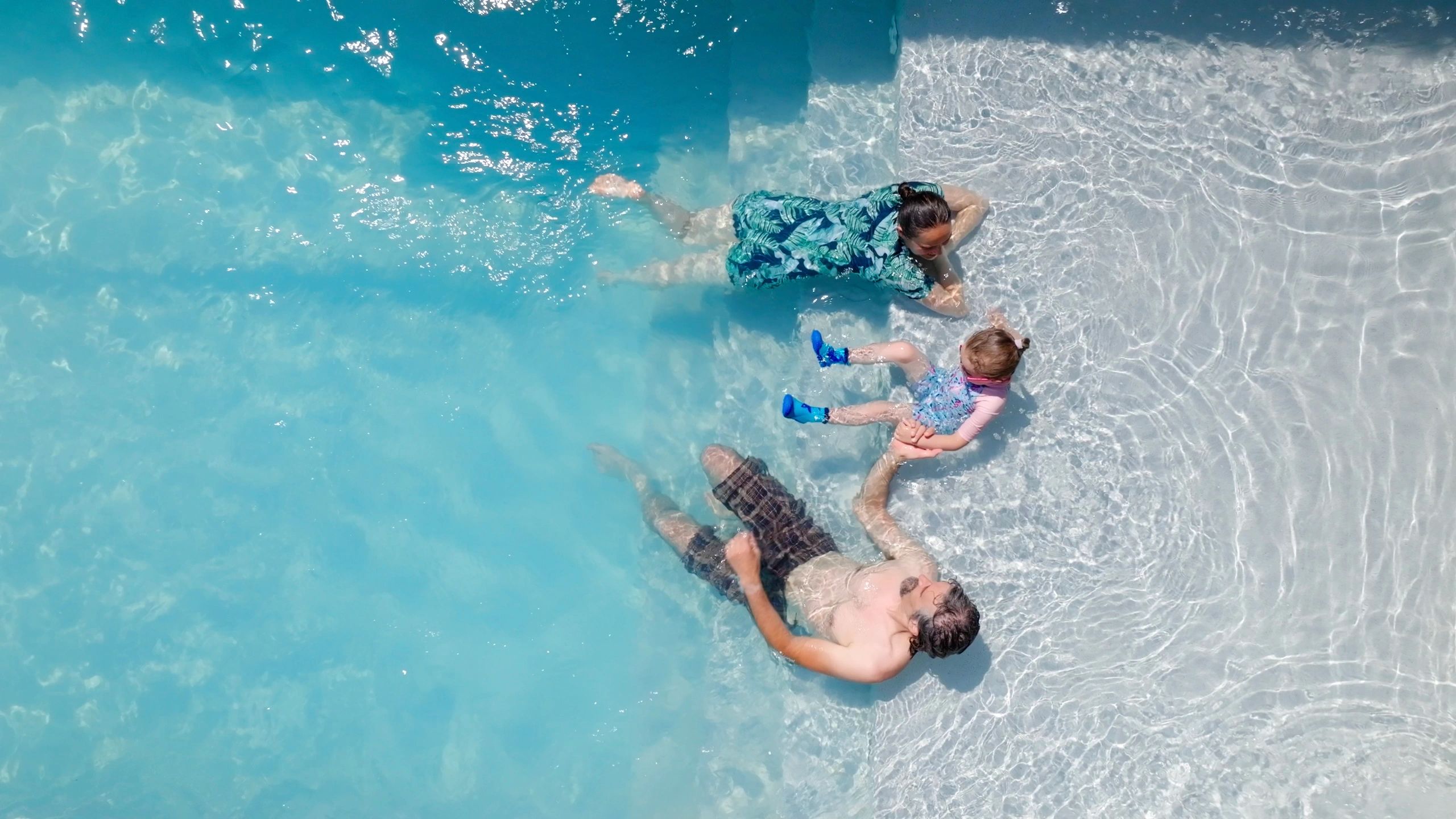 Guests relaxing in a resort pool